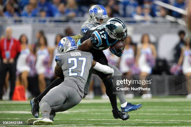 Carolina Panthers wide receiver Devin Funchess is tackled by Detroit Lions free safety Glover Quin during the first half of an NFL football game in...