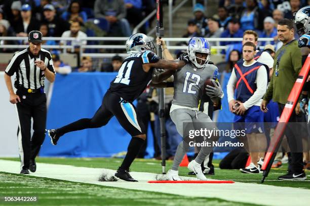 Detroit Lions wide receiver Bruce Ellington is pushed out of bounds by Carolina Panthers defensive back Captain Munnerlyn during the second half of...