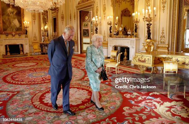 Prince Charles, Prince of Wales and Queen Elizabeth II walk out ahead of the formal opening of the Commonwealth Heads of Government Meeting , in the...