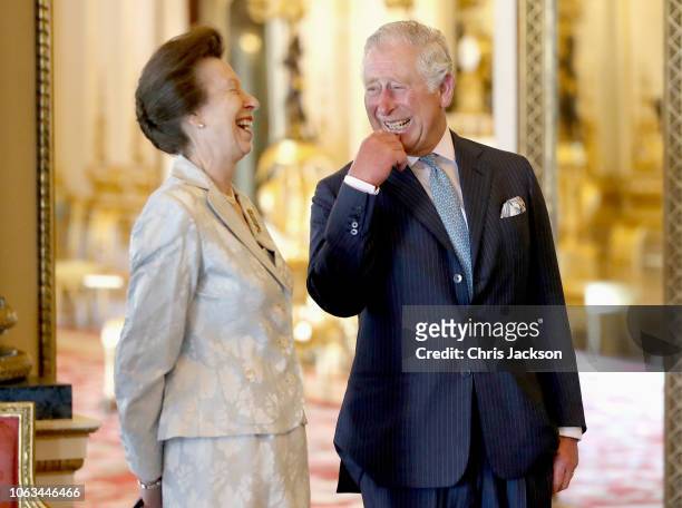 Prince Charles, Prince of Wales shares a joke with Princess Anne, Prince Royal as they wait with Members of the Royal Family ahead of the formal...