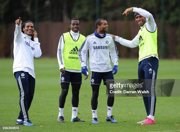 Florent Malouda, Gael Kakuta, Ashley Cole, Didier Drogba of Chelsea during a training session at the Cobham training ground on October 29, 2010 in...