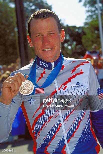 Lance Armstrong of the USA celebrates bronze in the Mens Road Cycling Individual Time Trial at Moore Park on day 15 of the Sydney 2000 Olympic Games...