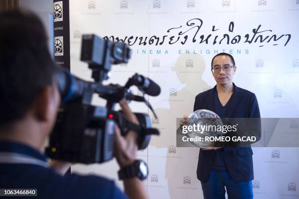 Thai filmmaker Apichatpong Weerasethakul poses with the 2018 FIAF Award from the International Federation of Film Archives during a ceremony at the...