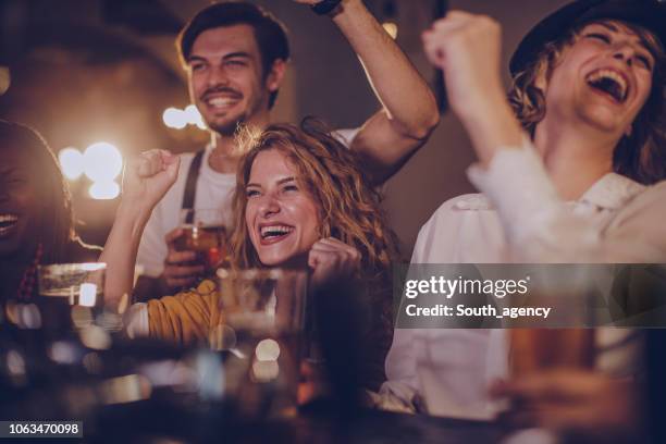 friends in pub watching match - local bar stock pictures, royalty-free photos & images