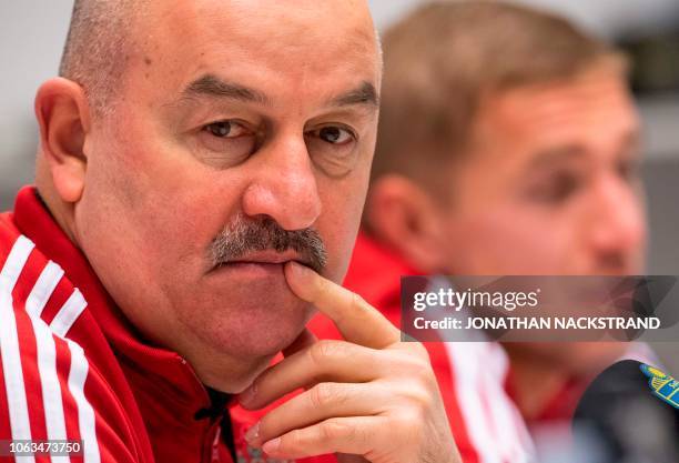 Russia's national football team head coach Stanislav Cherchesov and defender Yury Gazinsky attend a press conference on the eve of the UEFA Nations...