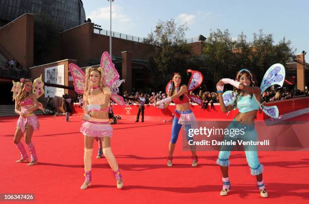 Performers dressed as Winx Club characters on the red carpet at