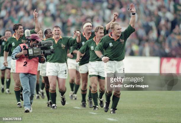 Springboks captain Francois Pienaar leads his team including Joost van der Westhuizen on a lap of celebration after their 1995 Rugby World Cup Final...