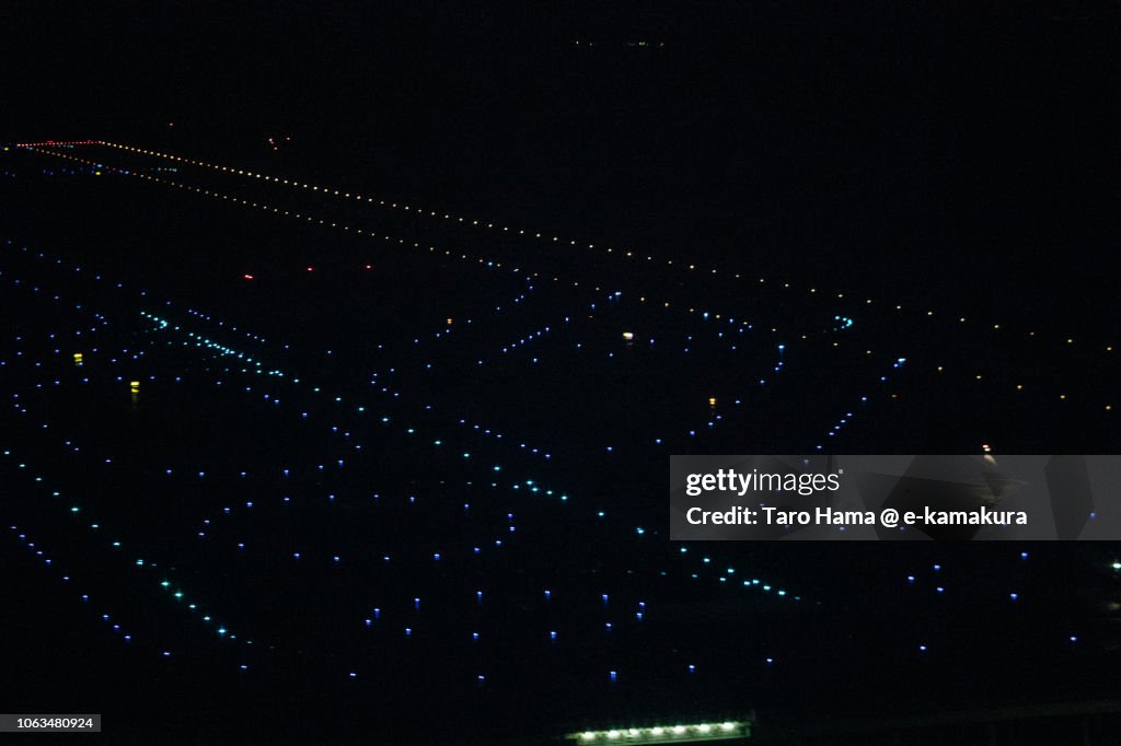 "D" runaway of Tokyo Haneda International Airport in Japan night time aerial view from airplane