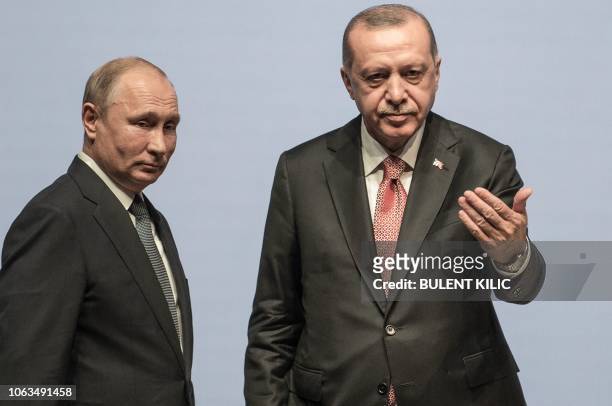 Turkish President Tayyip Erdogan and his Russian counterpart Vladimir Putin attend a ceremony marking the completion of the sea part of the...