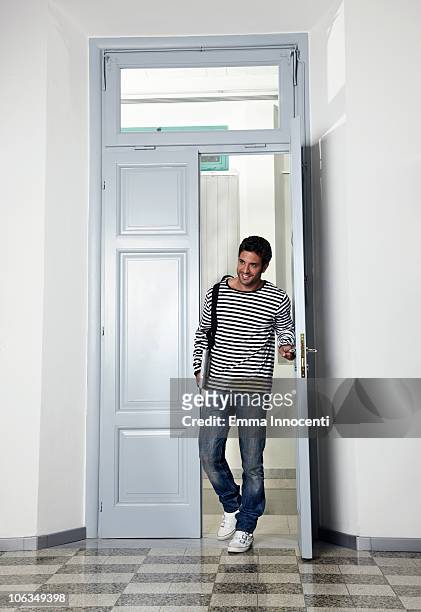 student entering room through doorway - entering stock pictures, royalty-free photos & images