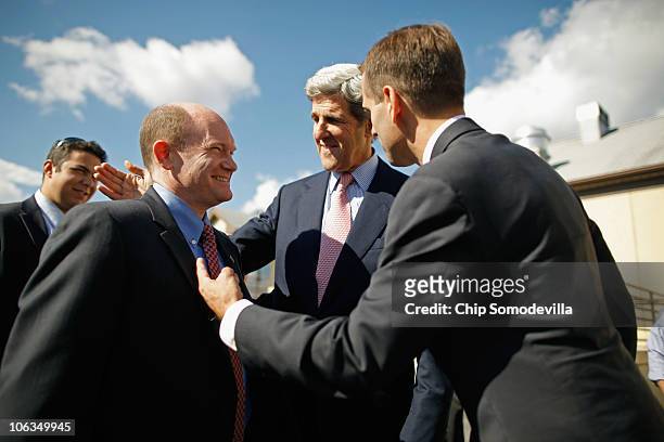 Delaware Democratic Senate nominee Chris Coons thanks U.S. Sen. John Kerry and Delaware Attorney General Beau Biden for campaigning with him outside...