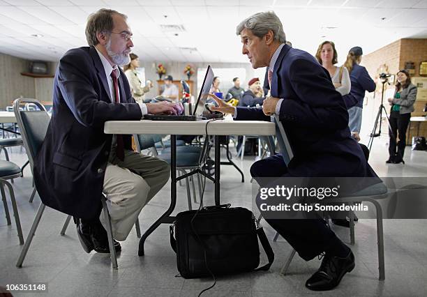 Sen. John Kerry is interviewed by Associated Press correspondent Randall Chase while Kerry campaigned for Delaware Democratic Senate nominee Chris...
