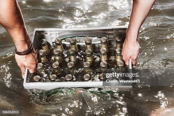 germany, cologne, couple carrying case of beer - beer flowing stock pictures, royalty-free photos & images