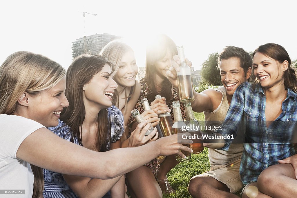 Germany, Cologne, Man and women enjoying beer