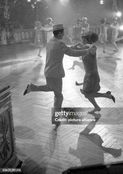 Young couple is dancing the charleston during a carnival festival on 26 February 1963 at the German Theater in Munich. | usage worldwide