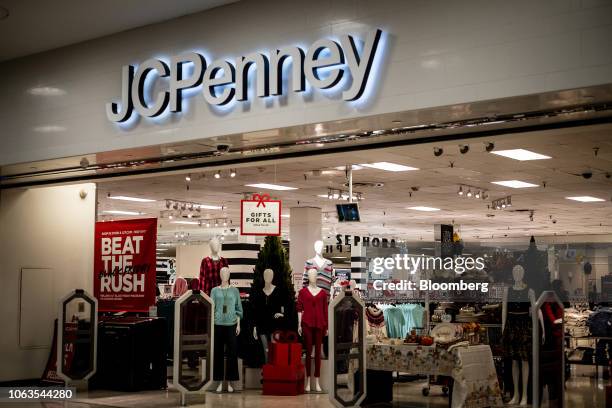 Black Friday advertisement is displayed next to mannequins at the entrance to a J.C. Penney store inside the Westfield Mall in Culver City,...