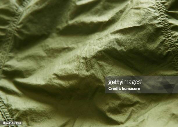 khaki green color nylon cloth wrinkles - nylon stockfoto's en -beelden