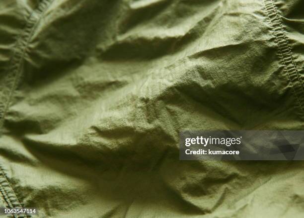 khaki green color nylon cloth wrinkles - nylon imagens e fotografias de stock