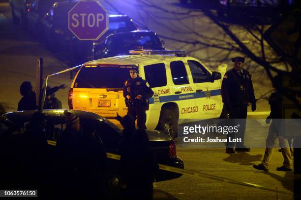 Police officers stand outside Mercy Hospital after a gunman shot multiple people on November 19, 2018 in Chicago, Illinois. Five people were shot...