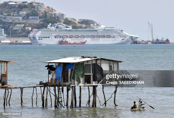 This picture taken on November 19, 2018 show makeshift huts seen across the ship accommodating delegates and journalists attending the Asia-Pacific...