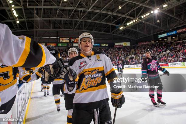 Braden Schneider of the Brandon Wheat Kings skates along the bench to celebrate a goal against the Kelowna Rockets at Prospera Place on November 3,...