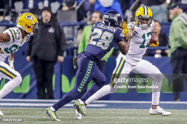 Green Bay Packers Wide Receiver Davante Adams applies a stiff arm to Seattle Seahawks Cornerback Justin Coleman during the week 11 Thursday night NFL...