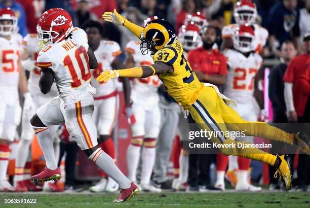 Tyreek Hill of the Kansas City Chiefs catches a first down catch in front of Sam Shields of the Los Angeles Rams during the second quarter of the...