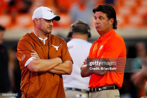 Head coach Tom Herman of the Texas Longhorns talks with head coach Mike Gundy of the Oklahoma State Cowboys on October 27, 2018 at Boone Pickens...