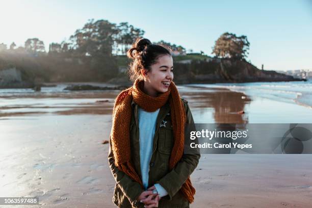 beautiful  woman outdoor walking and smiling - woman long brown hair stock pictures, royalty-free photos & images