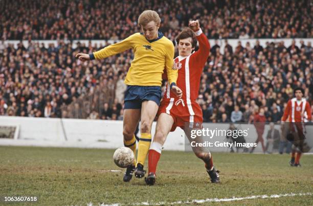 Arsenal player David Price in the yellow change kit is challenged by Orient defender Glenn Roeder during the 1978 FA Cup Final Semi Final match at...