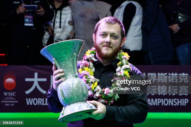 Mark Allen of Northern Ireland poses with his trophy after winning the final match against Neil Robertson of Australia on day eight of the 2018 World...