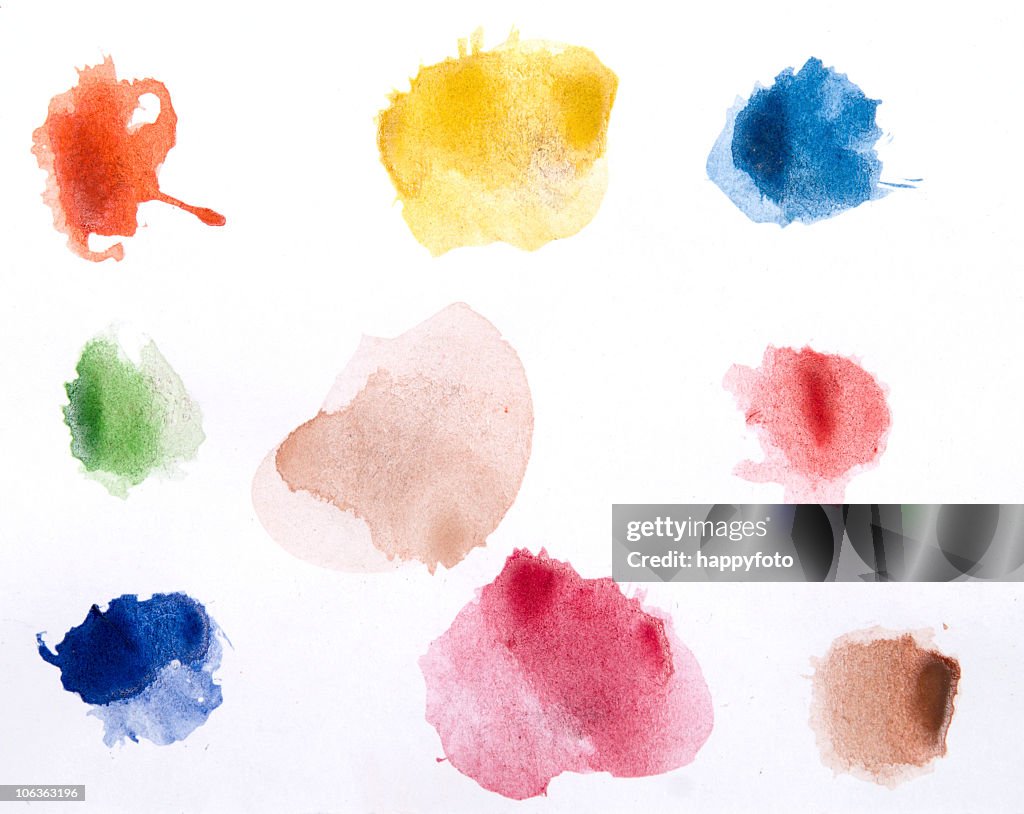 Watercolor paints on a white piece of paper ready to use