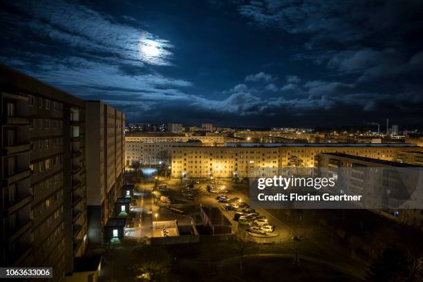 An industrialized apartment block is pictured during moon light on November 19, 2018 in Stendal, Germany.