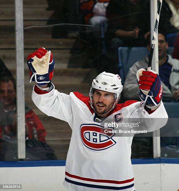 Brian Gionta of the Montreal Canadiens celebrates a third period goal by Travis Moen against the New York Islanders at the Nassau Coliseum on October...