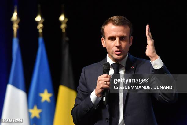 French President Emmanuel Macron gives a speech during his visit at the University of Louvain on November 20 in Louvain-la-Neuve, during a two-day...