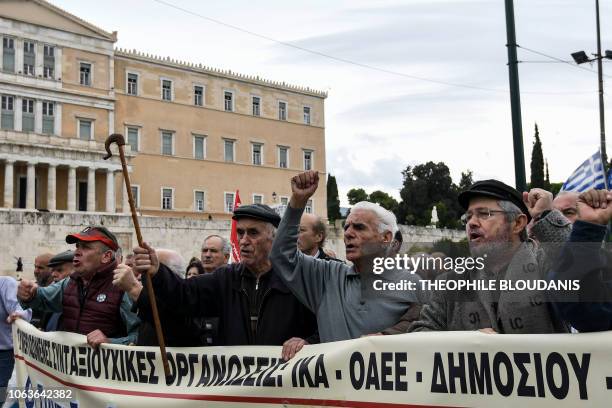 Pensioners shout slogans in central Athens on November 20 during a demonstration against further pension cuts planned by the Greek government.