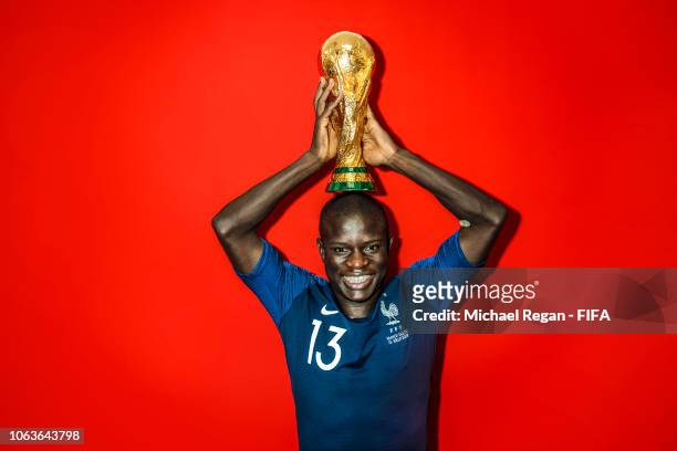 Golo Kante of France poses with the Champions World Cup trophy after the 2018 FIFA World Cup Russia Final between France and Croatia at Luzhniki...