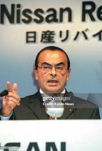 File photo taken in October 1999 shows Carlos Ghosn, then chief operating officer of Nissan Motor Co., announcing the company's revival plan at a...