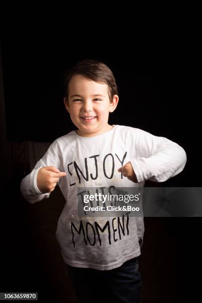 portrait of a five years old boy with a black background - 4 5 years stock-fotos und bilder