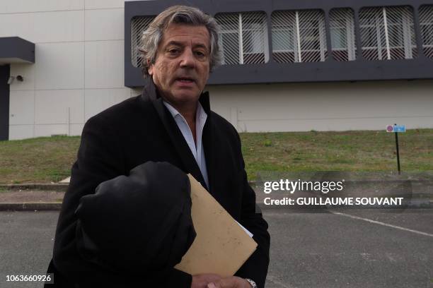Lawyer Jean-Claude Romand, Jean-Louis Abad, walks on November 20 as he leaves the prison of Saint-Maur, central France, where his client, sentenced...
