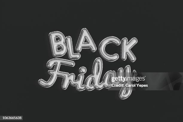 black friday silver balloon on black background - black balloons stock pictures, royalty-free photos & images