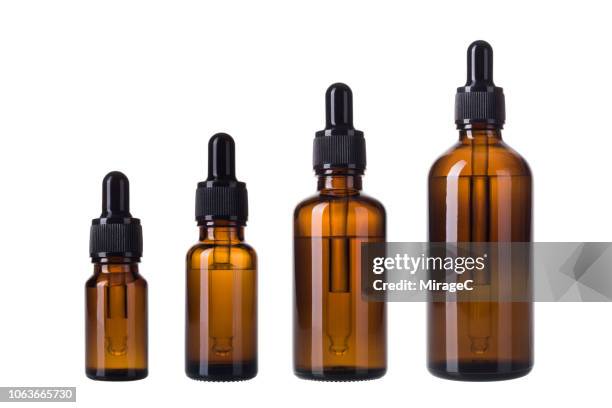 essential oil bottles - botella con gotero fotografías e imágenes de stock