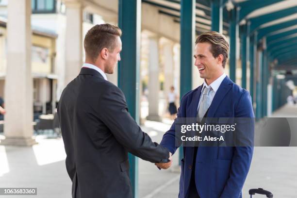 business people handshake - standing apart stock pictures, royalty-free photos & images