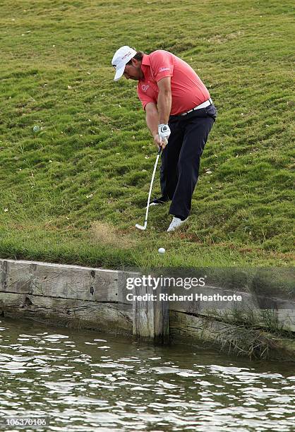 Graeme McDowell of Northern Ireland hits his approach to the 10th green from the hazard during the third round of the Andalucia Valderrama Masters at...