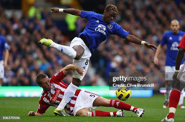 Louis Saha of Everton attempts to move past a challenge from Danny Collins of Stoke City during the Barclays Premier League match between Everton and...