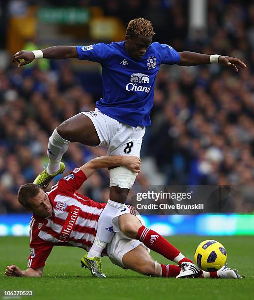 Louis Saha of Everton attempts to move past a challenge from Danny Collins of Stoke City during the Barclays Premier League match between Everton and...