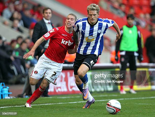 Daniel Jones of Sheffield Wednesday holds off Scott Wagstaff of Charlton Athletic during the npower League One match between Charlton Athletic and...