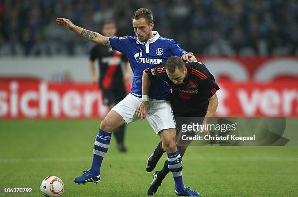 Ivan Rakitic of Schalke challenges Michal Kadlec of Leverkusen during the Bundesliga match between FC Schalke 04 and Bayer Leverkusen at the Veltins...