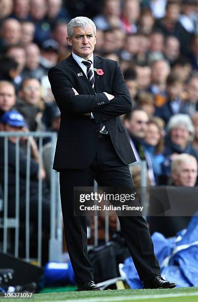 Mark Hughes manager of Fulham looks on during the Barclays Premier League match between Fulham and Wigan Athletic at Craven Cottage on October 30,...
