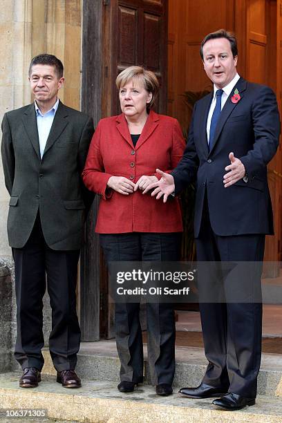 British Prime Minster David Cameron greets the German Chancellor Angela Merkel and her husband Joachim Sauer outside Chequers, the Prime Minister's...